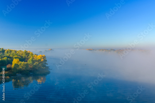 Fog over the water on a river Dnieper on autumn