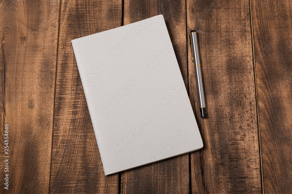 Fototapeta premium Mock-up magazine or catalog on wooden table.