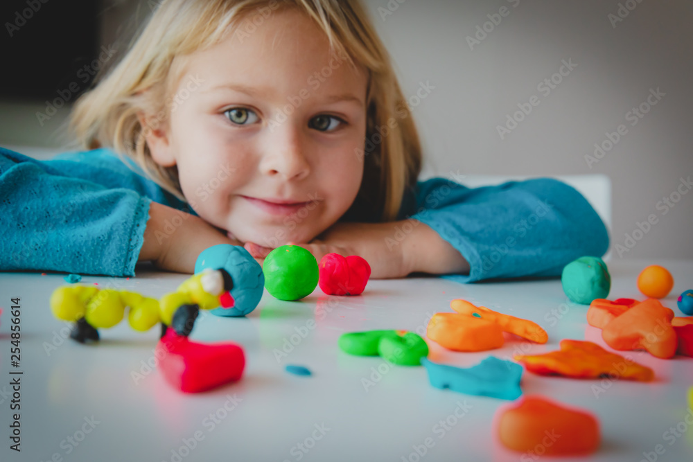 Little girl playing with clay molding shapes, kids crafts Little girl playing with clay molding shapes, kids crafts