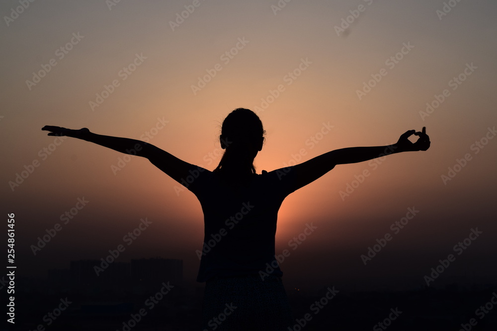 silhouette of a women in sunset