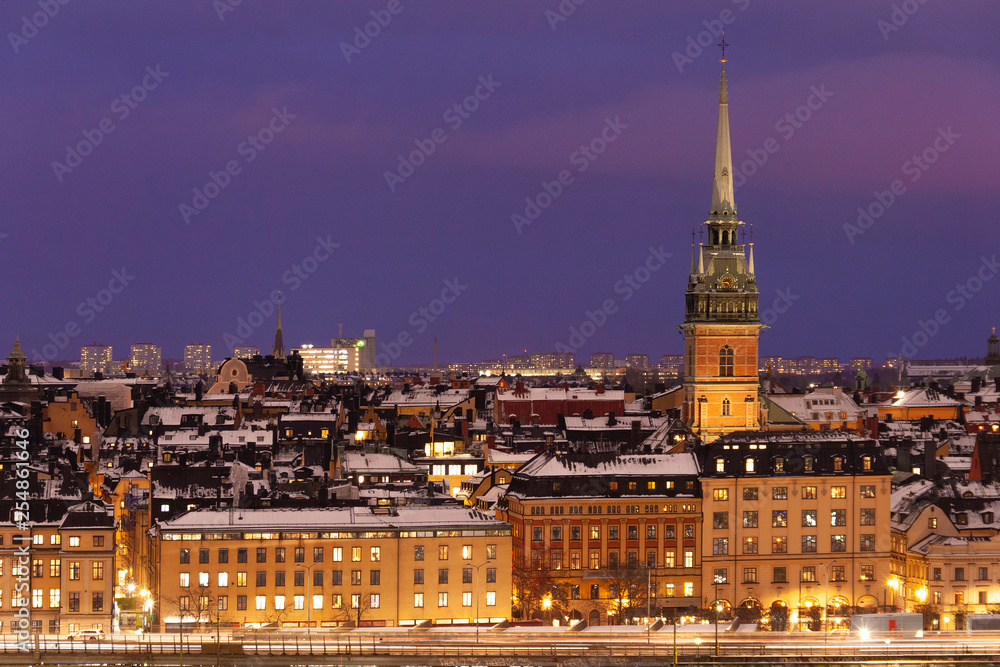 Snow on old building in winter Stockholm on sunset