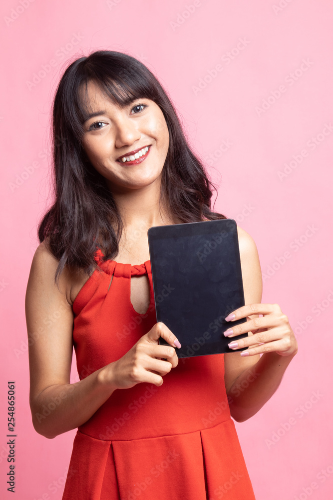 Young Asian woman with a computer tablet. Young Asian woman with a computer tablet.