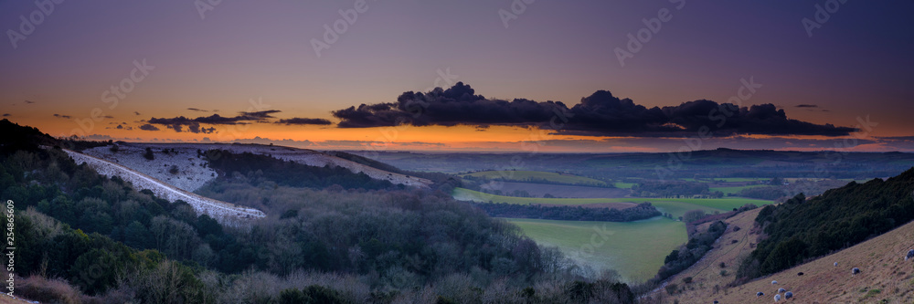 Winter sunset over Old Winchester Hill in the South Downs National Park, Hampshire, UK Winter sunset over Old Winchester Hill in the South Downs National Park, Hampshire, UK