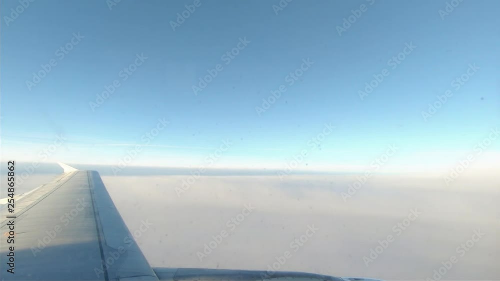 Airplane wing flying through the air Airplane wing flying through the air