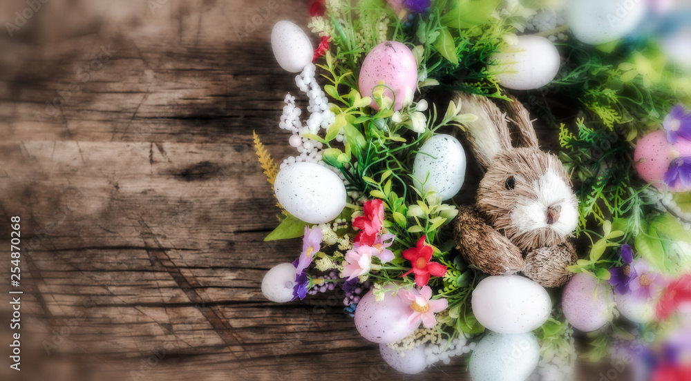 easter wreath with colorful eggs and flowers and a rabbit in the center easter wreath with colorful eggs and flowers and a rabbit in the center