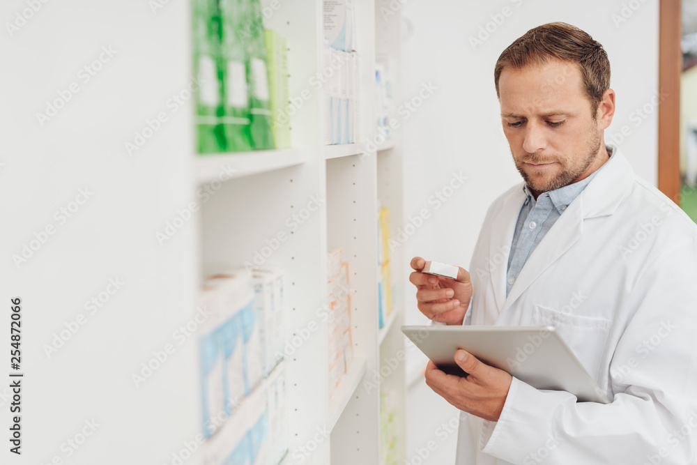 Pharmacist checking medication on the shelf