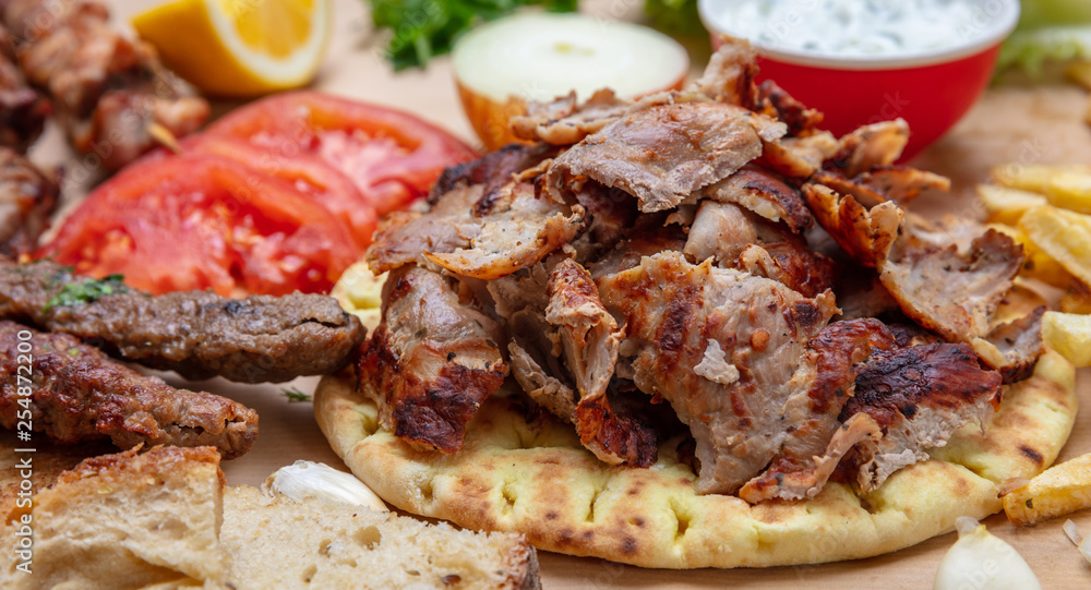 Shawarma, gyros pita, kebab. Traditional turkish, greek meat food on pita bread Shawarma, gyros pita, kebab. Traditional turkish, greek meat food on pita bread