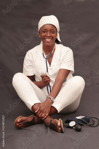 black nurse woman dressed in white coat