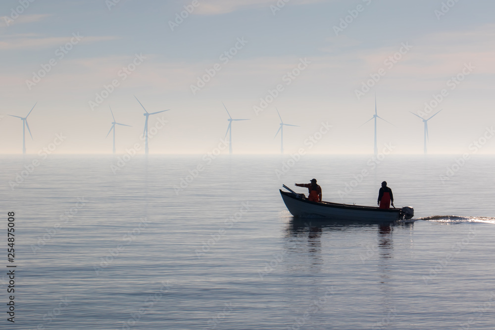 Naklejka premium Sustainable resources. Small fishing boat heading out to sea.