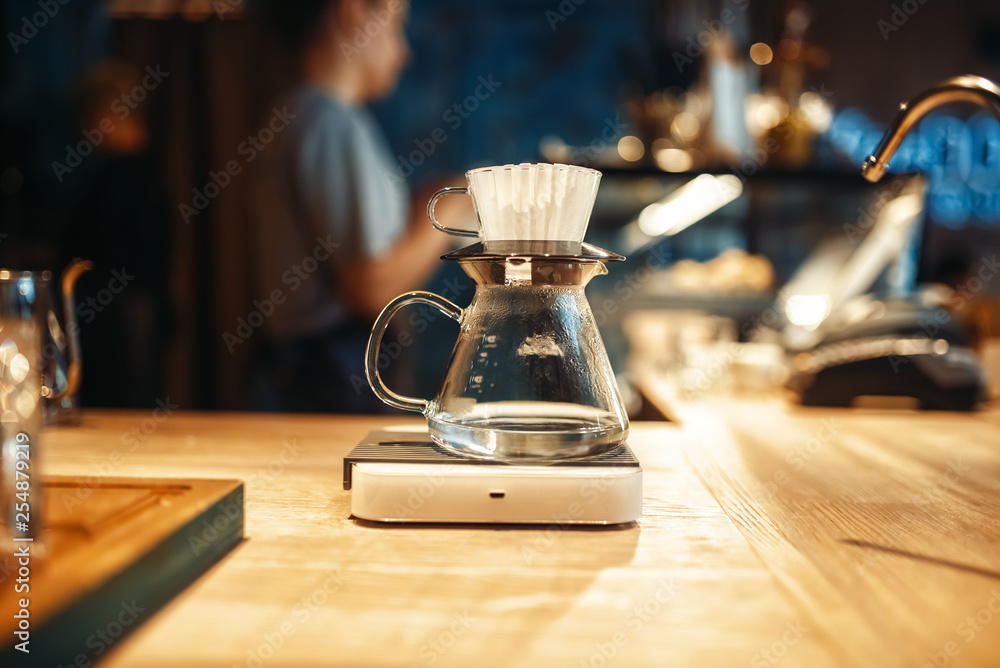 Glass coffee pot stands on stove closeup, nobody Glass coffee pot stands on stove closeup, nobody