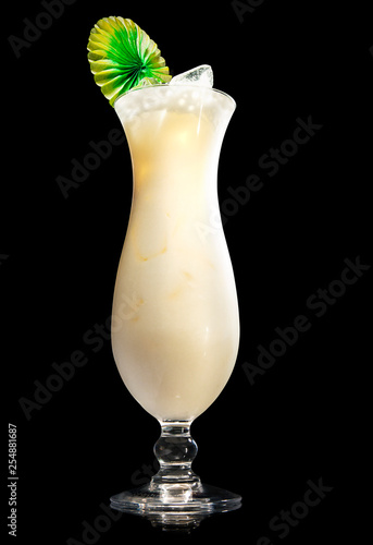pina colada cocktail on a black background