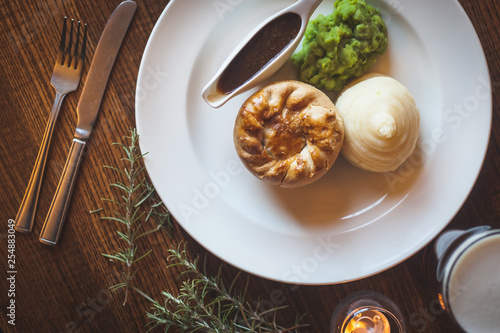 Mini pie, mashed potato and mushy peas