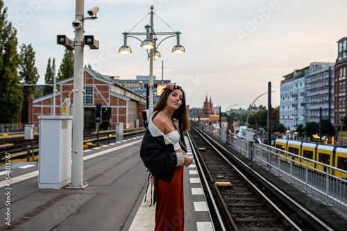 young woman on railway platform