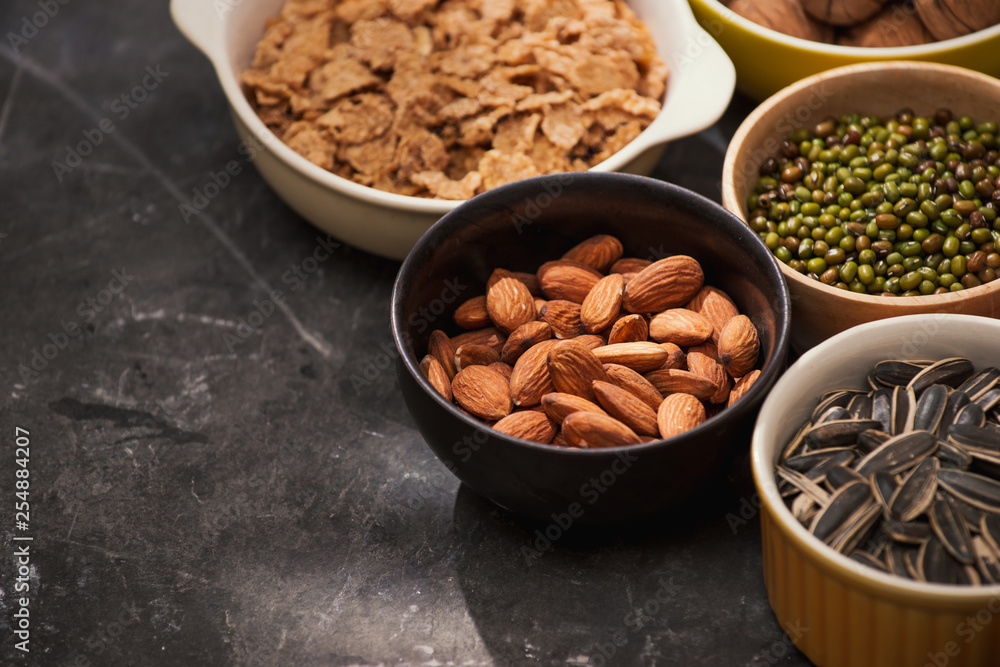 Different kinds of nuts in bowls. Different kinds of nuts in bowls.
