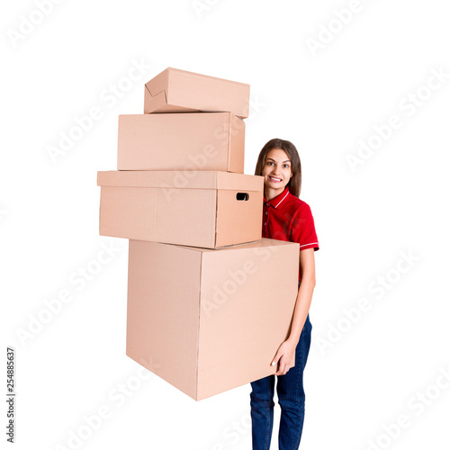 Portrait of a happy smiling delivery woman with heap of big boxes isolated on white background