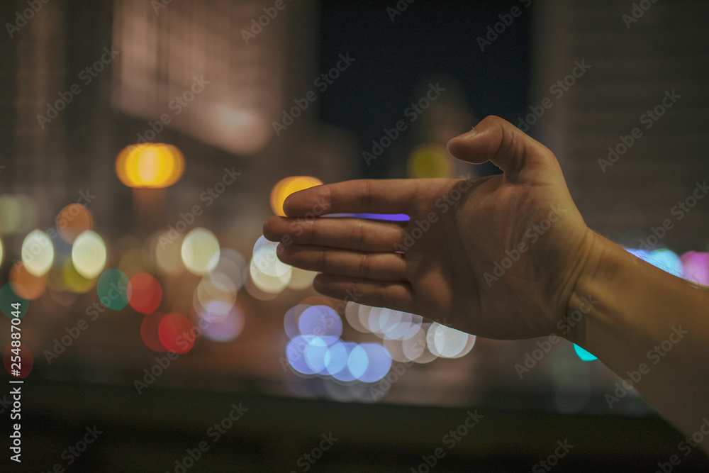 hand of man holding a glass of water hand of man holding a glass of water