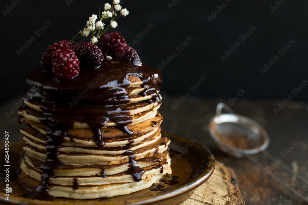 Vegan pancakes with chocolate sauce and raspberries Vegan pancakes with chocolate sauce and raspberries