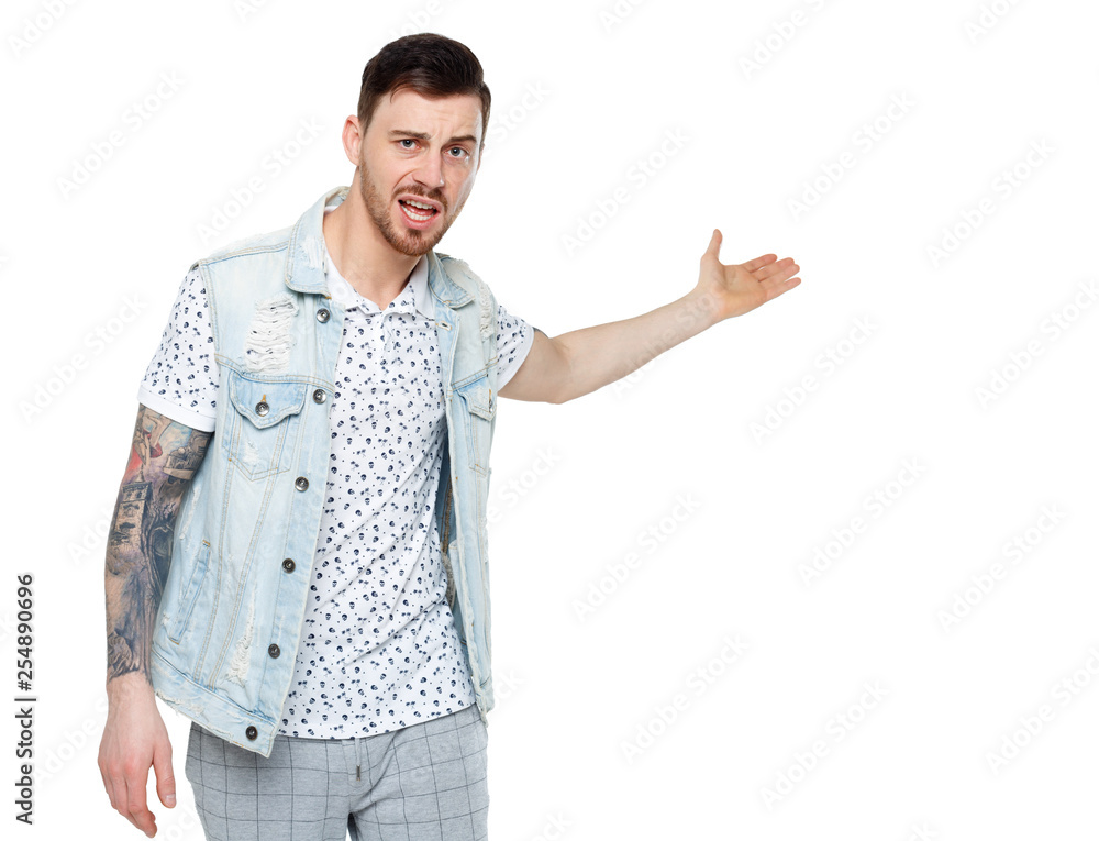 The man screams. Aggressive guy in tattoos yelling at the frame and showing his hands back. The man screams. Aggressive guy in tattoos yelling at the frame and showing his hands back.