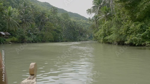 A river cruise on the Loboc River in the Bohol in the Philippines. This was a majestic lunch cruise that took you through a scenic route to the Busy falls and back. Slow Motion Footage. photo