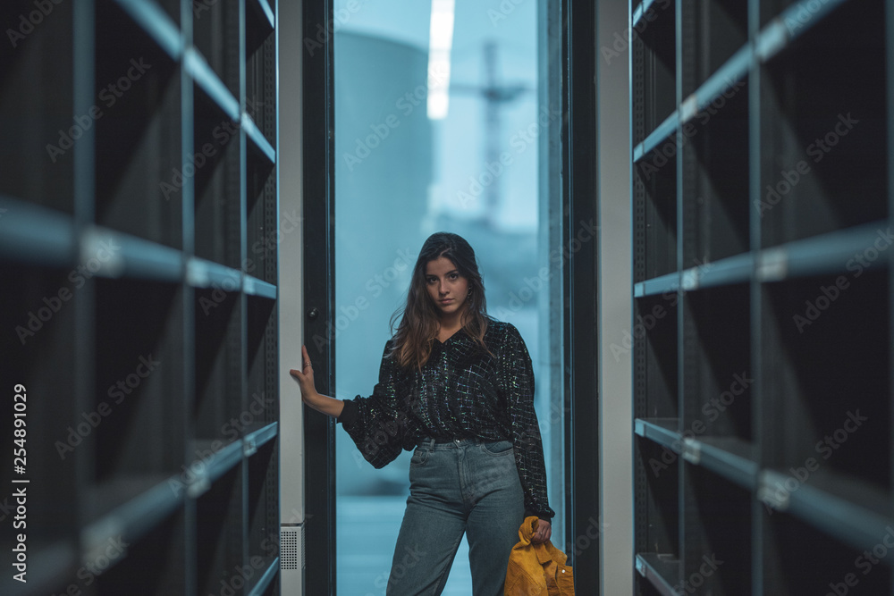 young woman in front of office building young woman in front of office building