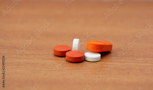 Closeup of colorful pills on on table
