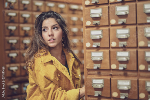 portrait of young woman have fun in a  Library colorated in Berlin by #tigerraw photo