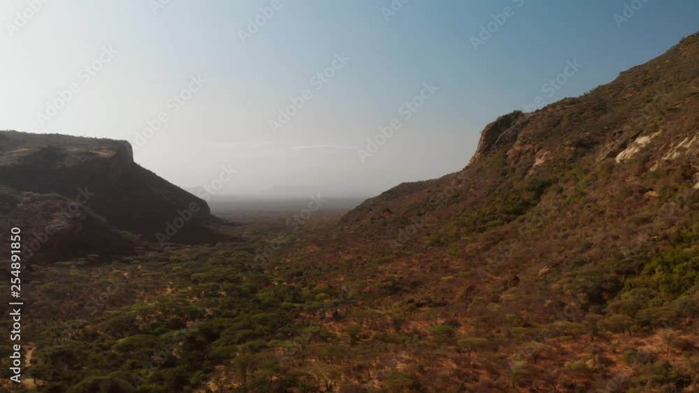 Aerial view of the sacred Mount Ololokwe of the Samburu people in Northern Kenya. Dynamic drone shot. Aerial view of the sacred Mount Ololokwe of the Samburu people in Northern Kenya. Dynamic drone shot.