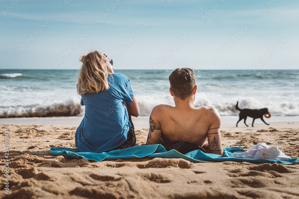 Lovely Couple relaxing at the Beach in Portugal Lovely Couple relaxing at the Beach in Portugal