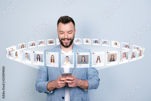 Close up photo interested he him his guy hold telephone addicted community mane friends trend addiction illustration pictures girls dating site futuristic creative design isolated grey background photo