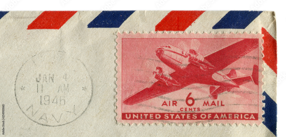 The United states of america - 4 Jan 1946: American historical stamp: six cents airmail with transport and passenger aircraft, black ink postal cancellation, Navy, USA The United states of america - 4 Jan 1946: American historical stamp: six cents airmail with transport and passenger aircraft, black ink postal cancellation, Navy, USA