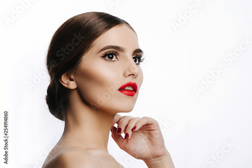 Beauty Woman Portrait. Spa model girl headshot. Pretty young woman touching her face. Skin care. Youth. Beautiful Fashion Model Girl Face. Perfect Skin. On white Background 