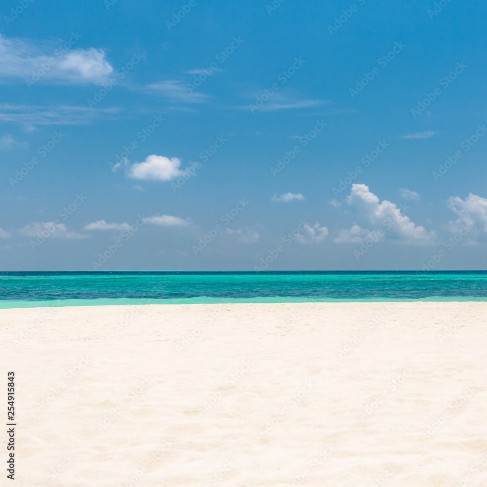 Empty beach scene with white sand and blue sea view. Sea sand sky concept Empty beach scene with white sand and blue sea view. Sea sand sky concept