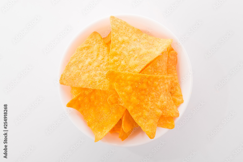 White bowl with golden and tasty nacho chips White bowl with golden and tasty nacho chips