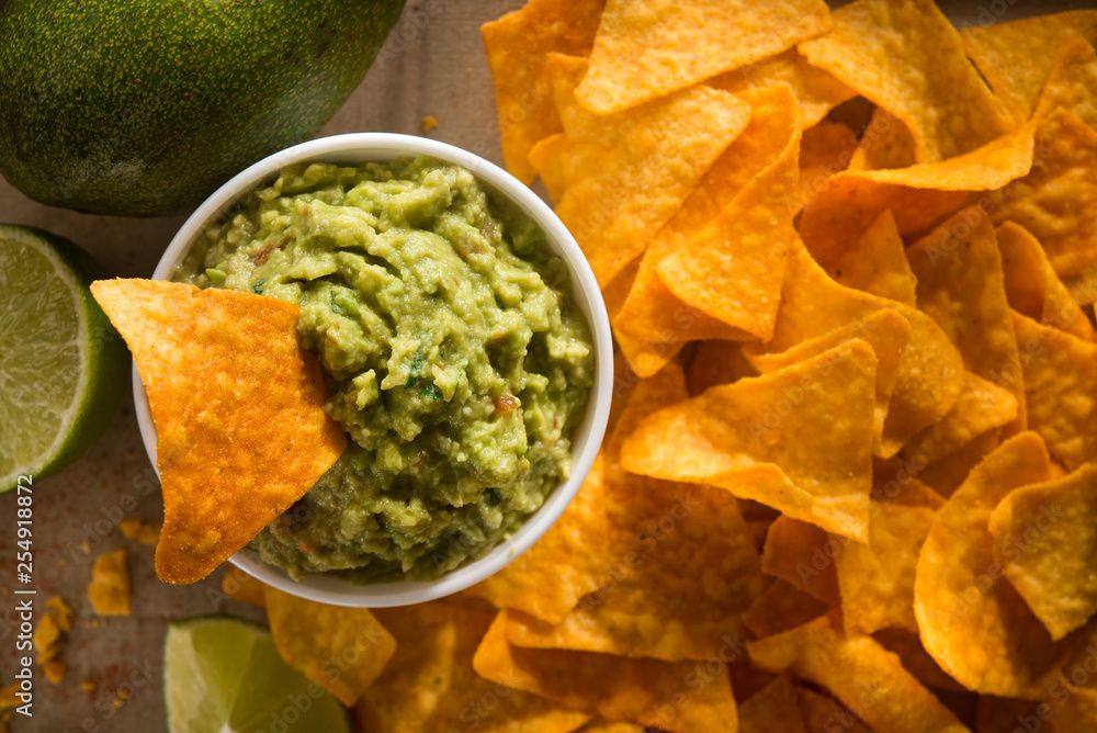 Golden tortilla chips with guacamole Golden tortilla chips with guacamole