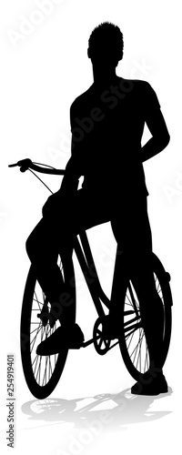 A bicycle riding bike cyclist in silhouette