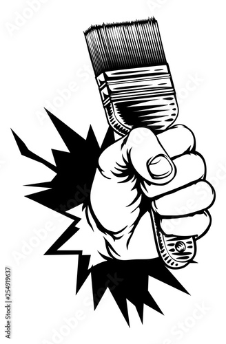 A fist hand holding a decorators paintbrush and breaking through the background or wall in a vintage intaglio woodcut engraved or retro propaganda style