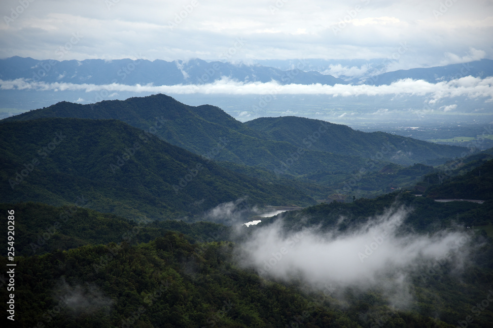 Aerial view of the morning foggy landscape in the mountains. The morning view on the hilltop. Aerial view of the morning foggy landscape in the mountains. The morning view on the hilltop.