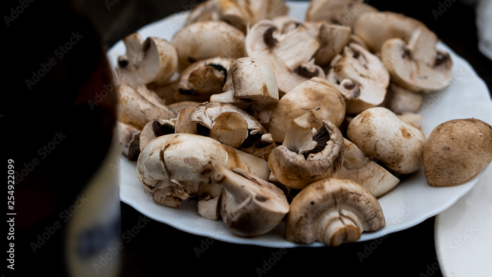 Fototapeta premium fresh mushrooms on wooden table