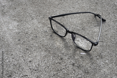 broken glasses lying on the street asphalt