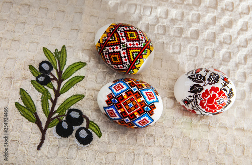 Colorful Easter Eggs on White Towel photo