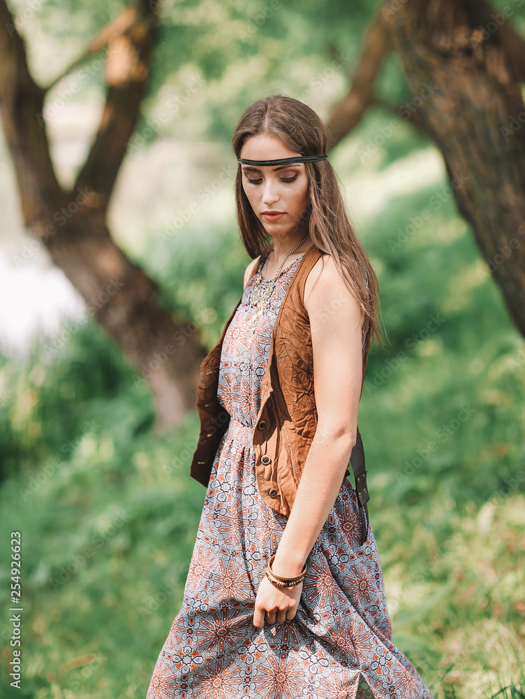 beautiful hippie girl on spring forest background
