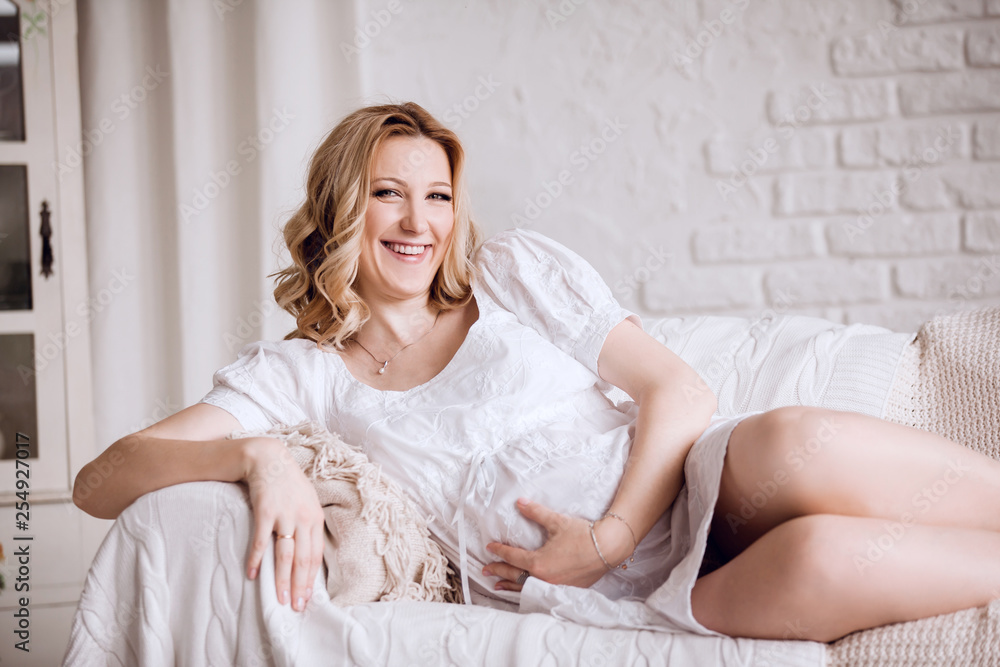 close up. young pregnant woman lying on couch close up. young pregnant woman lying on couch
