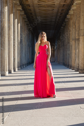 young woman in pink long dress