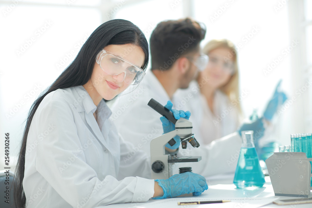 close up.scientists and laboratory workers sitting at the laboratory table close up.scientists and laboratory workers sitting at the laboratory table