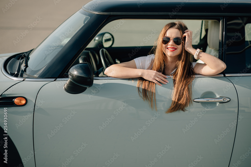 Girl  driving a car. Young beautiful woman in car.