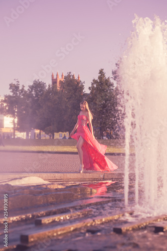 young woman in pink dress