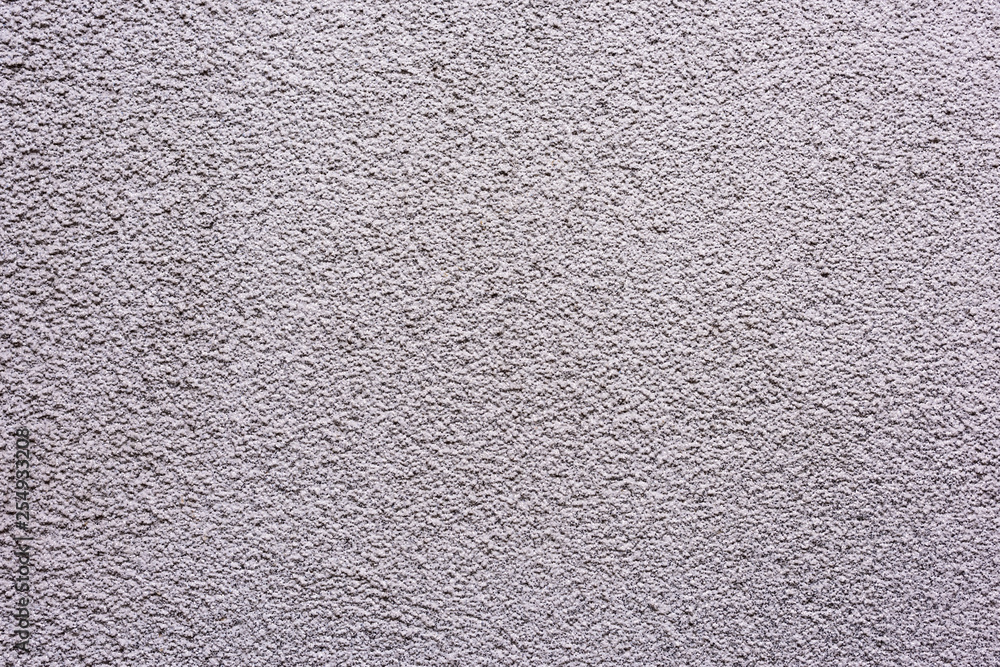 Eine graue Fassade Mauer mit Struktur als Hintergrund Eine graue Fassade Mauer mit Struktur als Hintergrund