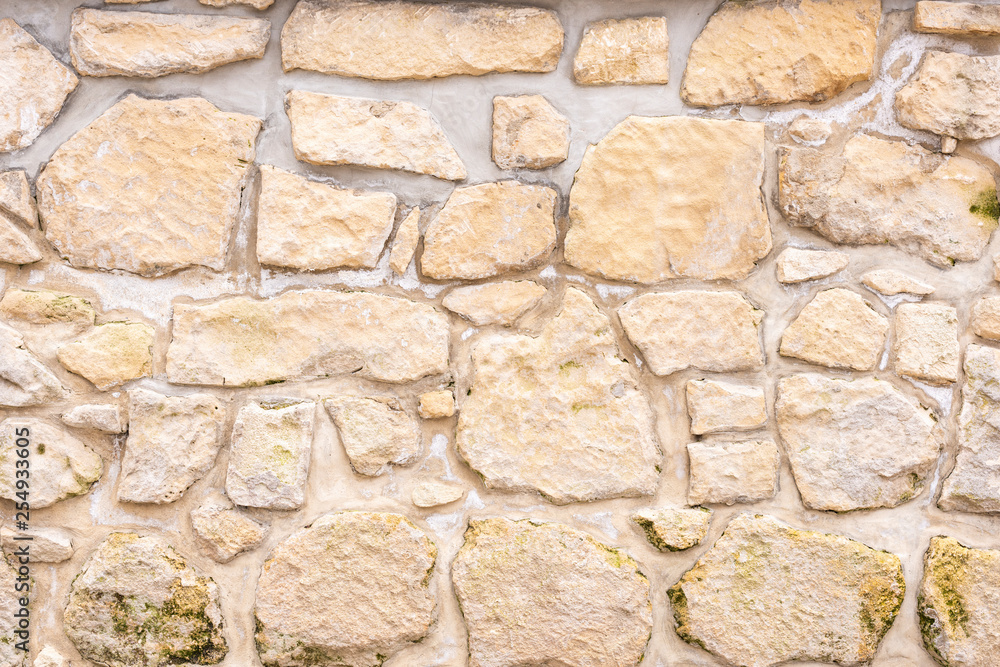 Eine Steinmauer mit große und kleine Steine als Hintergrund Eine Steinmauer mit große und kleine Steine als Hintergrund