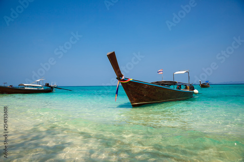 Traditional longtail boat on the tropical beach near Koh Phi Phi Island, Thailand © victoryb