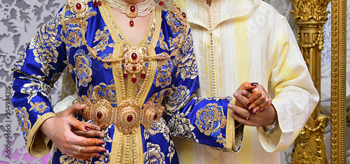Moroccan caftan in blue. Dressed by the Moroccan bride on her wedding day. Moroccan caftan is one of the most famous traditional clothing in the world photo